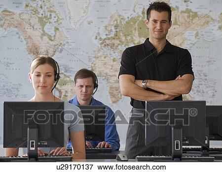 Call center employees with map in background View Large Photo Image Stock Photo - Call center employees with map in background. Fotosearch