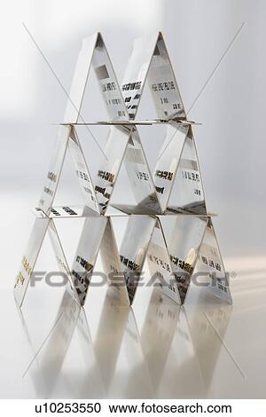 Stock Image - Card-house formed with credit cards. Fotosearch