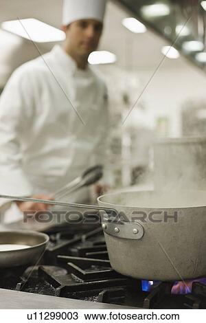 Chef and steaming pot on stove View Large Photo Image Stock Image - Chef and steaming pot on stove. Fotosearch