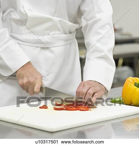 Chef chopping bell peppers View Large Photo Image Stock Image - Chef chopping bell peppers. Fotosearch