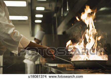 Chef holding flaming pan View Large Photo Image Picture - Chef holding flaming pan. Fotosearch
