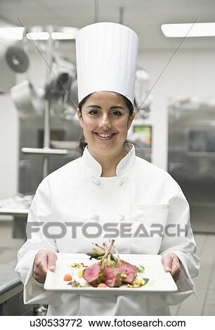 Chef presenting gourmet entree View Large Photo Image Stock Image - Chef presenting gourmet entree. Fotosearch