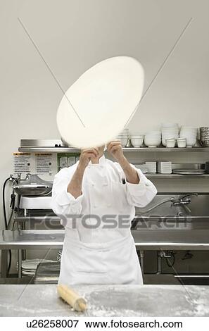 Chef tossing pizza dough View Large Photo Image Stock Photo - Chef tossing pizza dough. Fotosearch