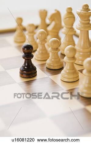 Stock Image - Chess pieces on chessboard. Fotosearch