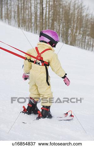 Child skiing with harness View Large Photo Image Stock Photo - Child skiing with harness. Fotosearch