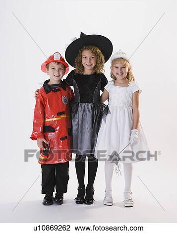 Stock Image - Children dressed in Halloween costumes. Fotosearch