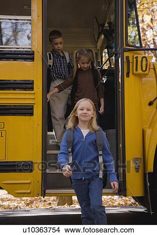 Picture - Children getting off school bus. Fotosearch