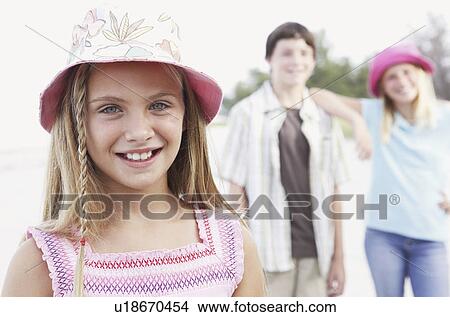 Picture - Children posing on beach. Fotosearch