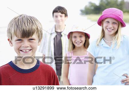 Children posing on beach View Large Photo Image Stock Photo - Children posing on beach. Fotosearch