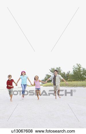 Stock Photo - Children running on beach. Fotosearch