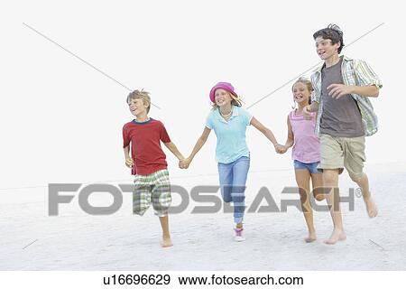 Children running on beach View Large Photo Image Stock Photo - Children running on beach. Fotosearch