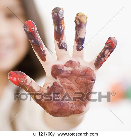Stock Photo - Child’s hand covered in paint. Fotosearch