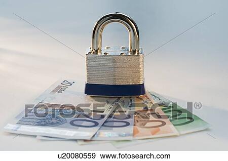 Close up lock and paper euros View Large Photo Image Stock Photo - Close up lock and paper euros. Fotosearch