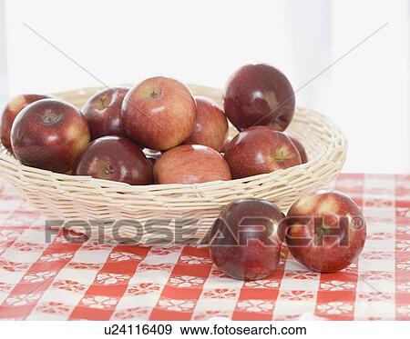 Stock Photo - Close up of apples in basket. Fotosearch