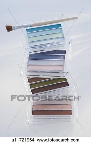 Close up of assorted cosmetics and brush View Large Photo Image Picture - Close up of assorted cosmetics and brush. Fotosearch