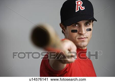 Close up of baseball player pointing bat View Large Photo Image Stock Image - Close up of baseball player pointing bat. Fotosearch