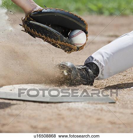 Close up of baseball player sliding into home plate View Large Photo Image Stock Photo - Close up of baseball player sliding into home plate. Fotosearch