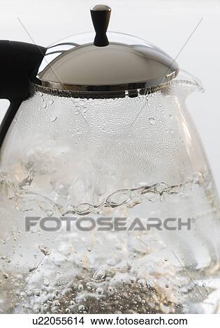 Picture - Close up of boiling water in tea pot. Fotosearch