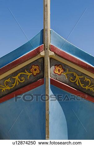 Stock Image - Close up of bow of Luzzu fishing boat. Fotosearch