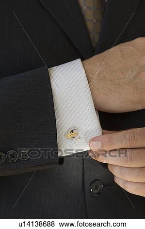 Close up of businessman with euro cuff link View Large Photo Image Stock Photo - Close up of businessman with euro cuff link. Fotosearch
