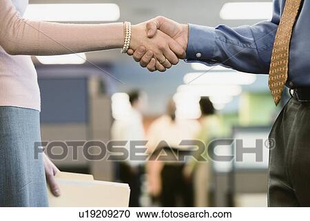 Close up of businesspeople shaking hands View Large Photo Image Stock Image - Close up of businesspeople shaking hands. Fotosearch