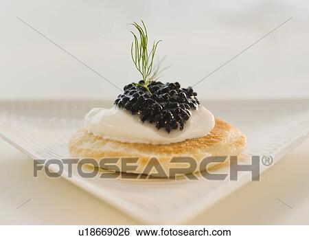 Stock Photograph - Close up of caviar appetizer. Fotosearch