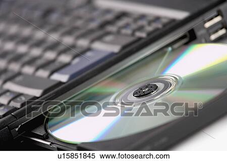 Close up of cd in laptop View Large Photo Image Stock Photography - Close up of cd in laptop. Fotosearch