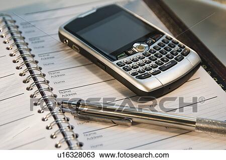 Close up of cell phone and address book View Large Photo Image Stock Image - Close up of cell phone and address book. Fotosearch
