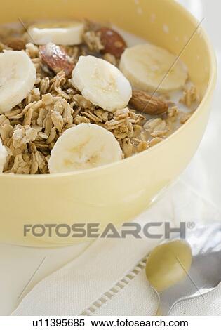 Stock Photography - Close up of cereal and banana slices. Fotosearch