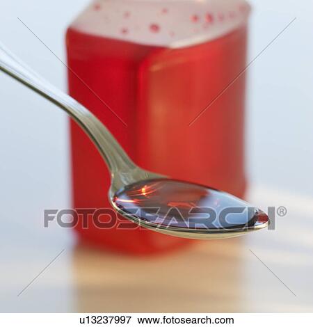 Close up of cough syrup View Large Photo Image Stock Photo - Close up of cough syrup. Fotosearch