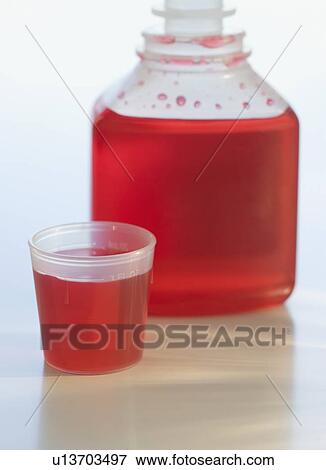 Close up of cough syrup View Large Photo Image Stock Photo - Close up of cough syrup. Fotosearch