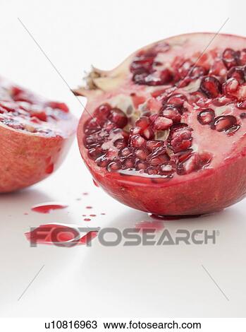 Close up of cut pomegranate View Large Photo Image Stock Image - Close up of cut pomegranate. Fotosearch