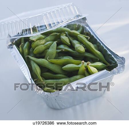 Stock Photograph - Close up of edamame in takeout container. Fotosearch