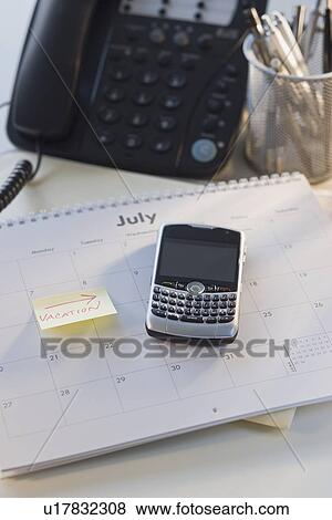 Close up of electronic organizer and calendar View Large Photo Image Stock Photo - Close up of electronic organizer and calendar. Fotosearch
