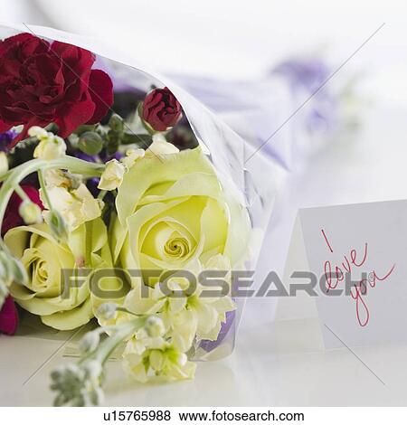 Stock Photo - Close up of flower bouquet and note. Fotosearch