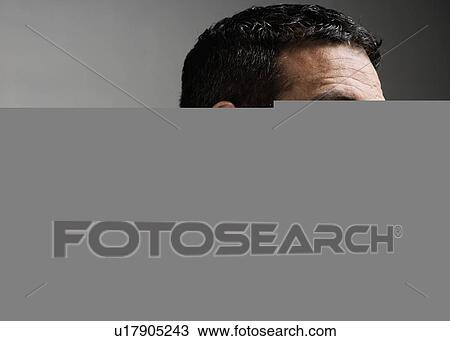 Stock Image - Close up of football player looking disappointed. Fotosearch
