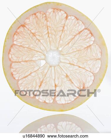 Stock Image - Close up of grapefruit slice. Fotosearch