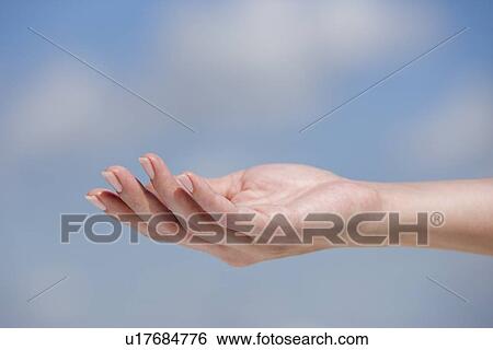 Close up of hand against sky View Large Photo Image Stock Photograph - Close up of hand against sky. Fotosearch