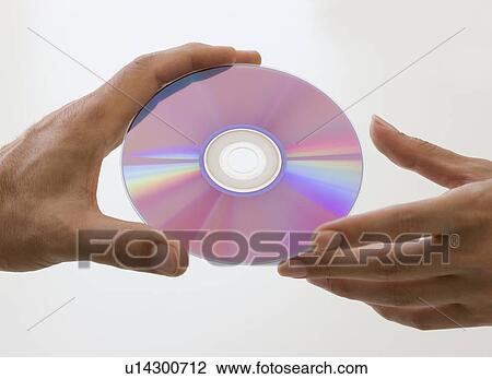 Close up of hands and compact disc View Large Photo Image Stock Image - Close up of hands and compact disc. Fotosearch