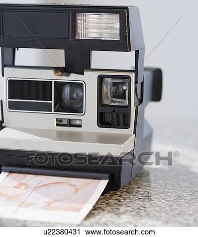 Stock Image - Close up of instant camera. Fotosearch