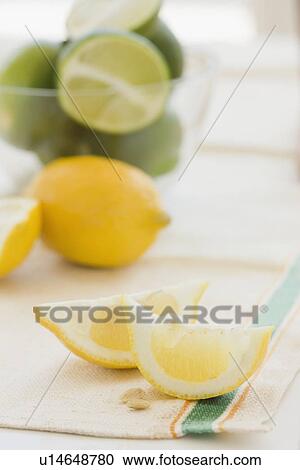 Close up of lemon and lime slices View Large Photo Image Stock Image - Close up of lemon and lime slices. Fotosearch
