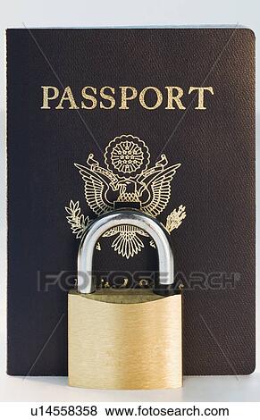 Stock Photo - Close up of lock and passport. Fotosearch