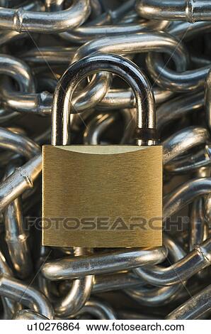 Close up of lock on pile of metal chain View Large Photo Image Picture - Close up of lock on pile of metal chain. Fotosearch