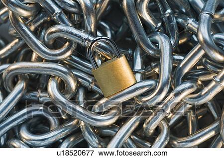Close up of lock on pile of metal chain View Large Photo Image Stock Photo - Close up of lock on pile of metal chain. Fotosearch