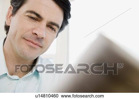 Close up of man reading View Large Photo Image Stock Image - Close up of man reading. Fotosearch