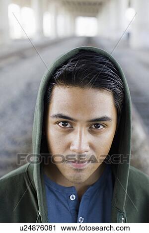 Close up of man wearing hoody View Large Photo Image Stock Image - Close up of man wearing hoody. Fotosearch