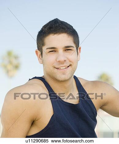 Close up of man wearing tank top View Large Photo Image Stock Photography - Close up of man wearing tank top. Fotosearch