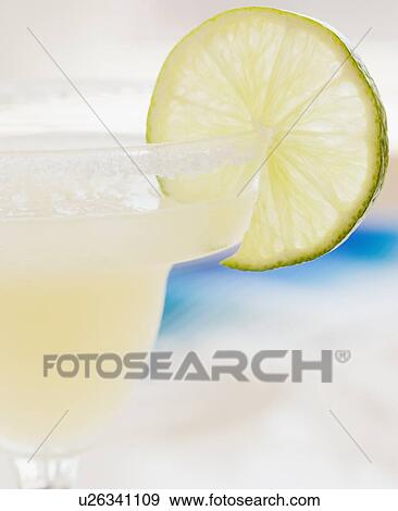 Close up of margarita and lime garnish View Large Photo Image Stock Photo - Close up of margarita and lime garnish. Fotosearch