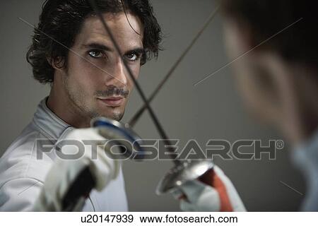 Close up of men fencing View Large Photo Image Stock Photo - Close up of men fencing. Fotosearch