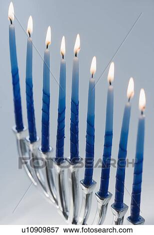 Close up of menorah with lit candles View Large Photo Image Stock Photo - Close up of menorah with lit candles. Fotosearch